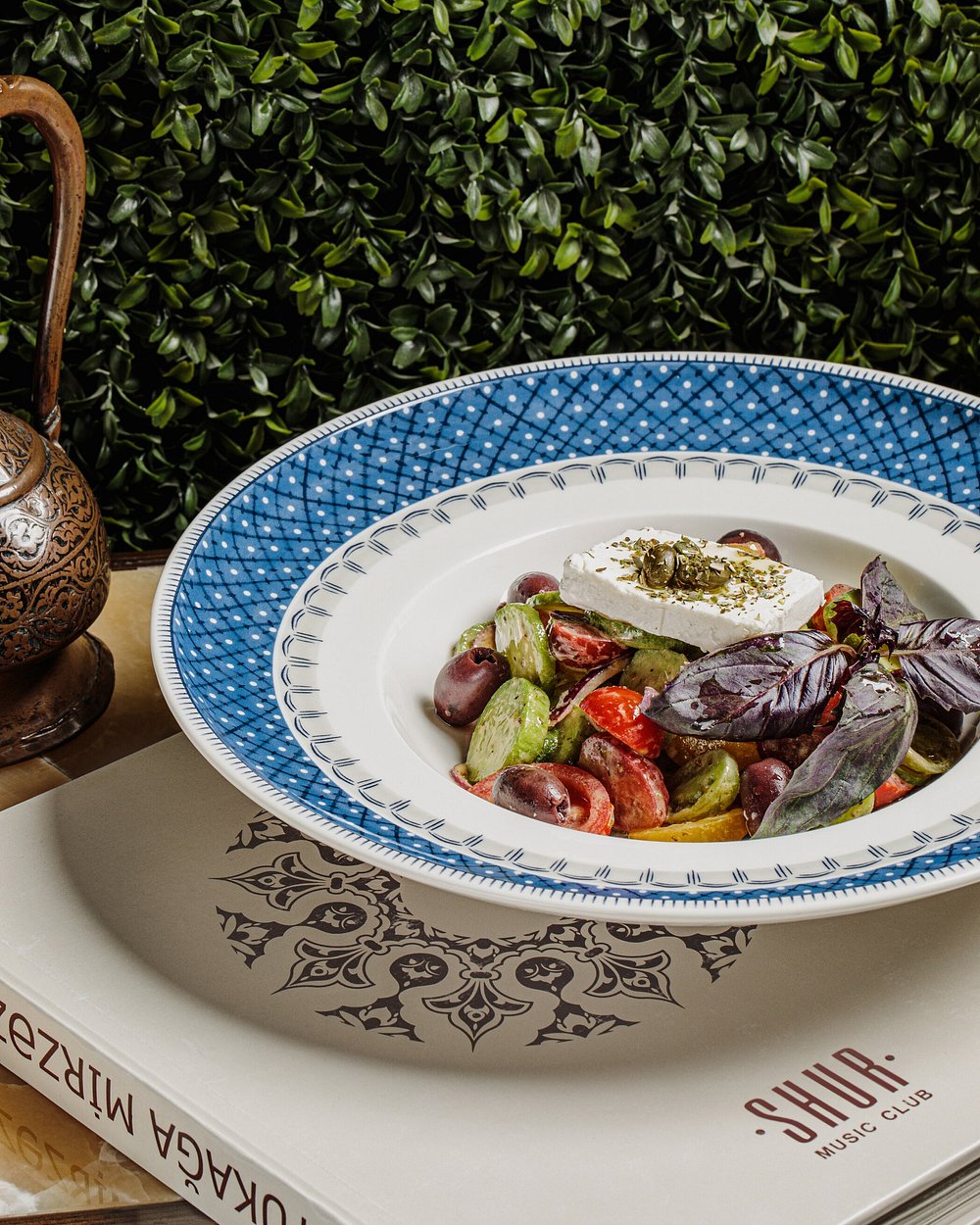 A salad of tomato, cucumber, olive and white cheese with purple basil at Shur in Baku