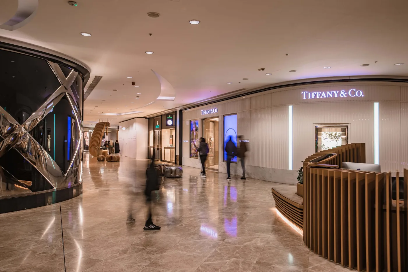 The marble boutique gallery at Port Baku Mall, lit along the walkway