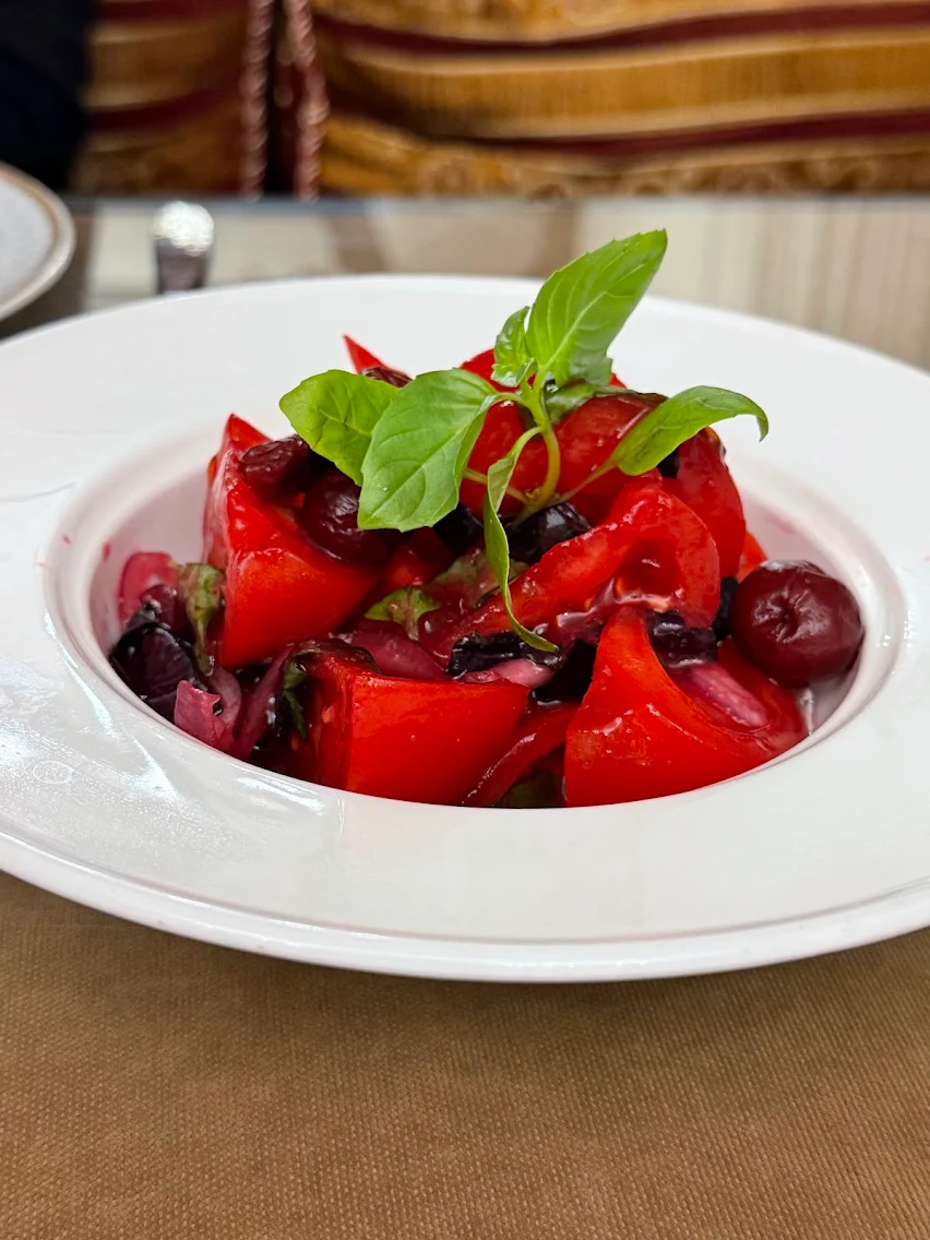 Tomato salad with cherries, red onion and basil at Shirvanshah in Baku
