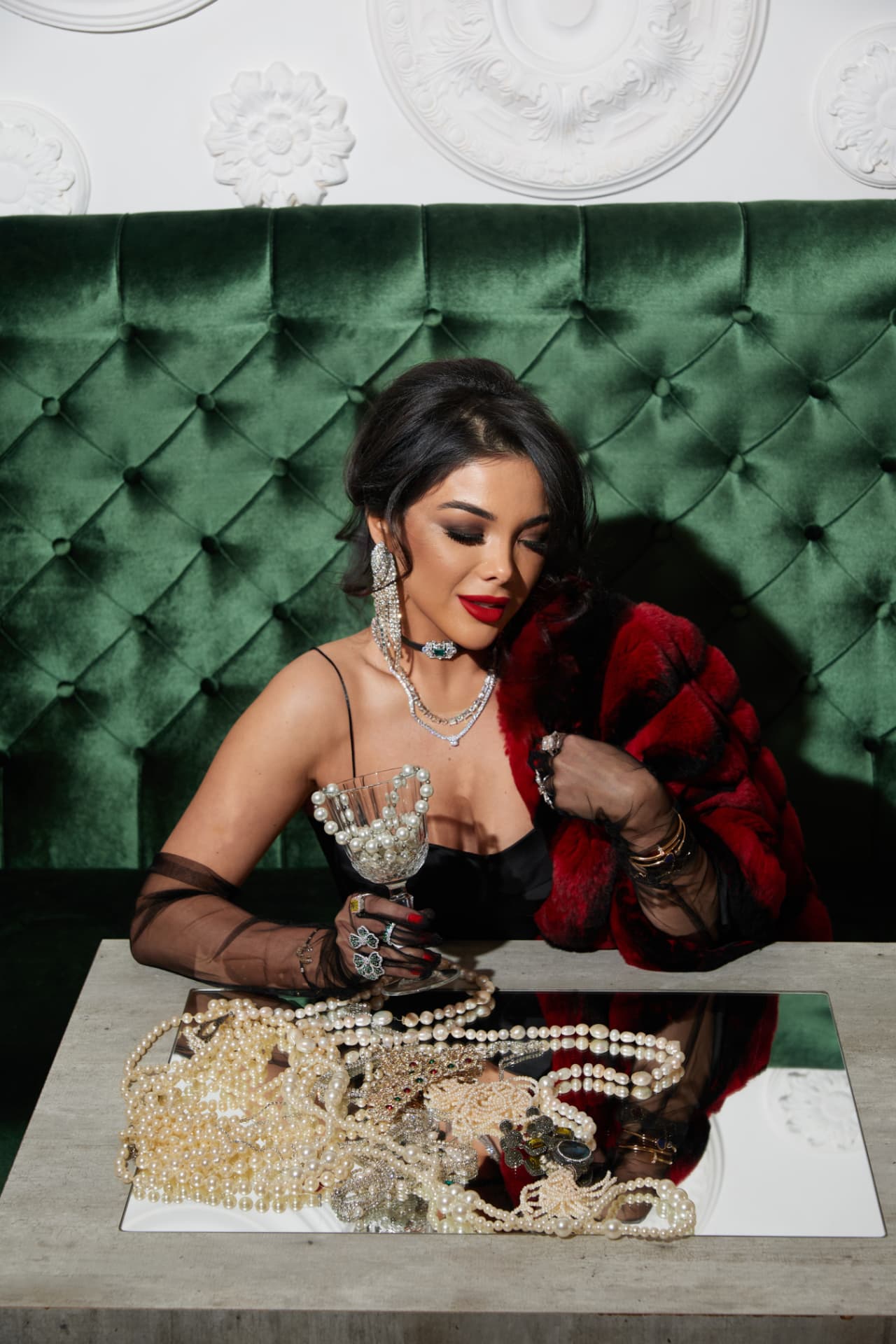 Kamila Verdiyeva seated in a Merci Baku salon